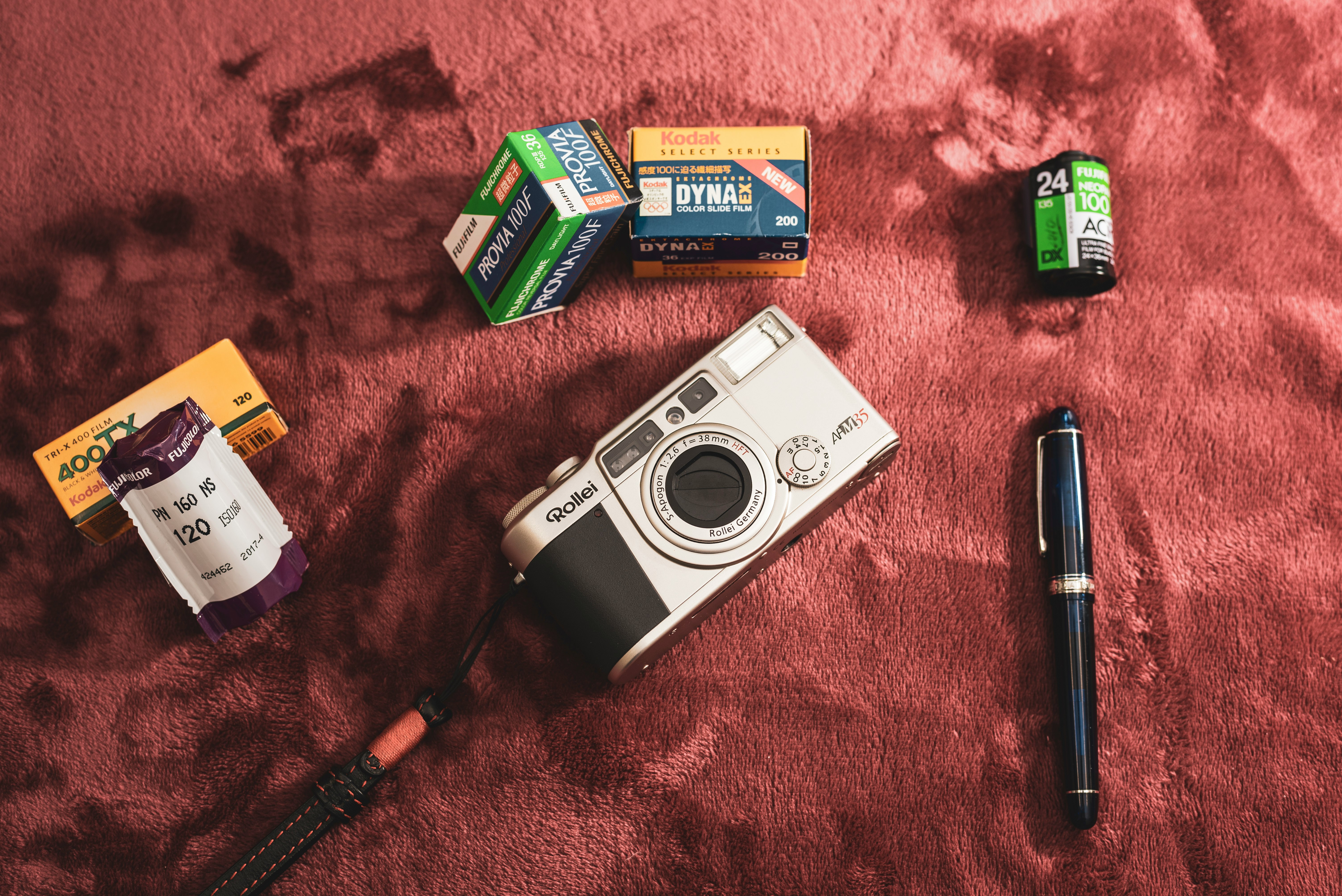 gray and black nikon camera beside green and yellow box